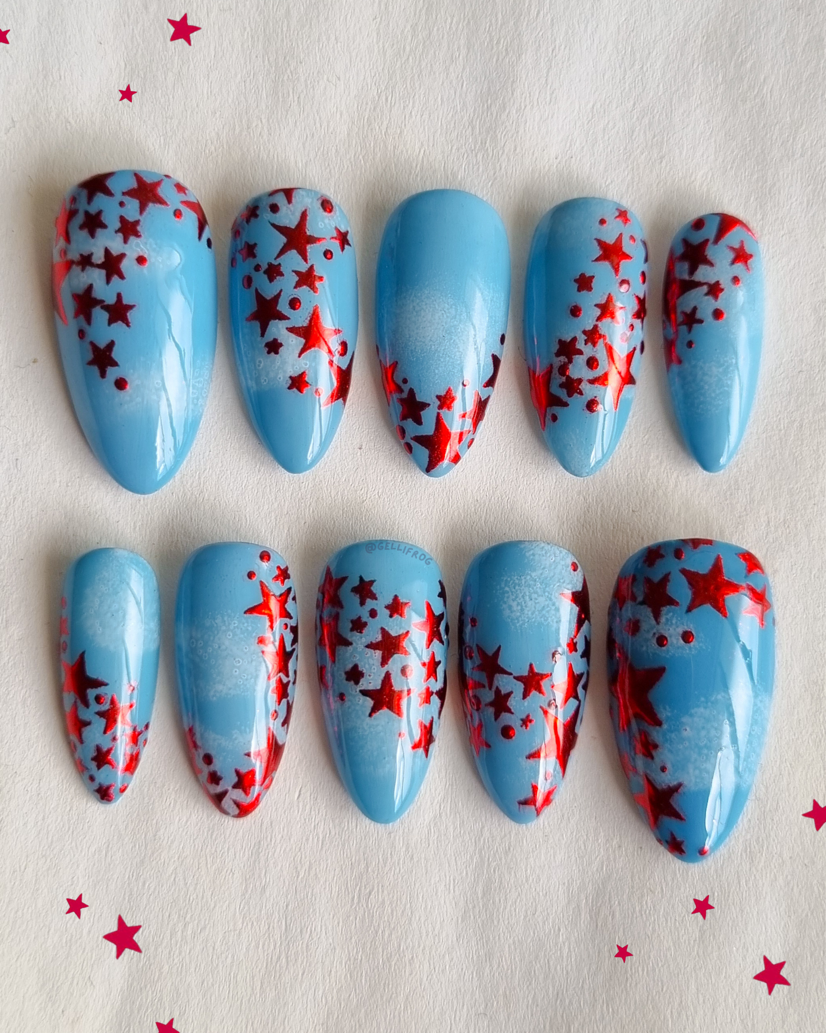 Ruby the Red Fairy medium almond red star and blue sky press-on nails by Gellifrog – handmade gel set
