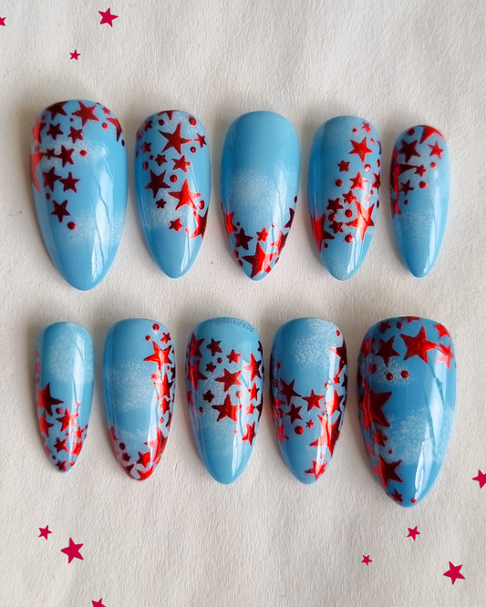 Ruby the Red Fairy medium almond red star and blue sky press-on nails by Gellifrog – handmade gel set