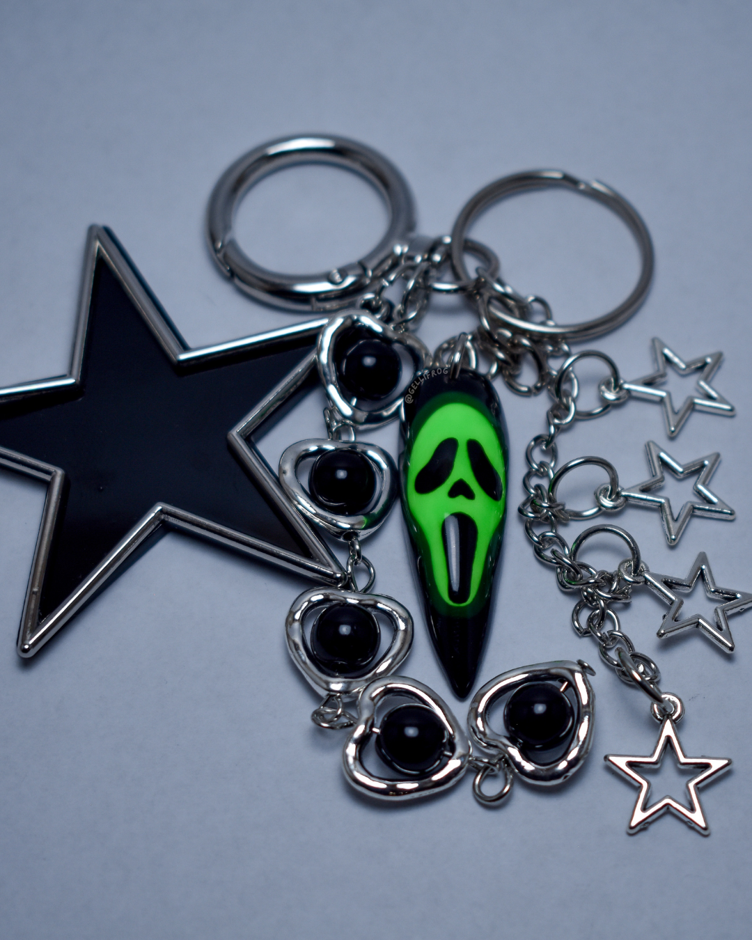 Glowface hand-painted UV neon green ghostface nail keychain by Gellifrog with NFC