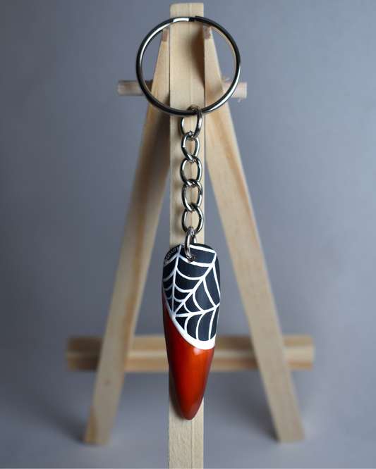 Halloween in Spring Keychain with hand-painted orange cat eye tip and white spiderweb nail by Gellifrog with NFC